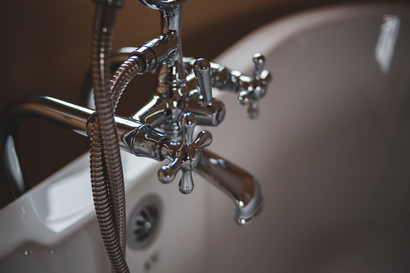 A plumber working at a sink